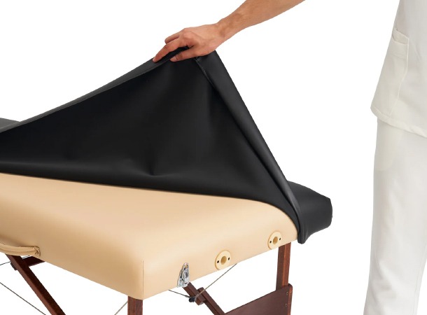 Massage table cover protecting against spills and stains