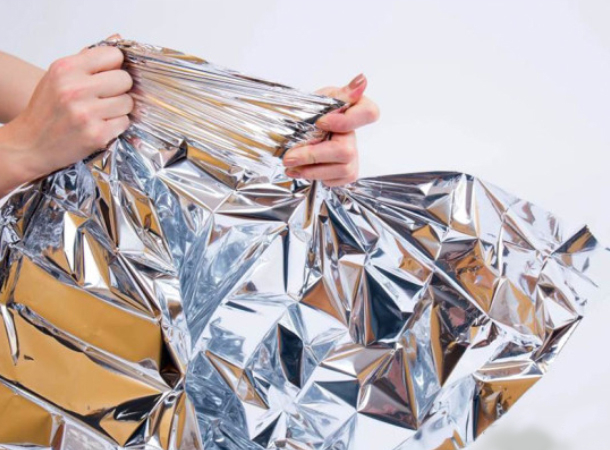 Compact folded thermal emergency blanket for first aid kit