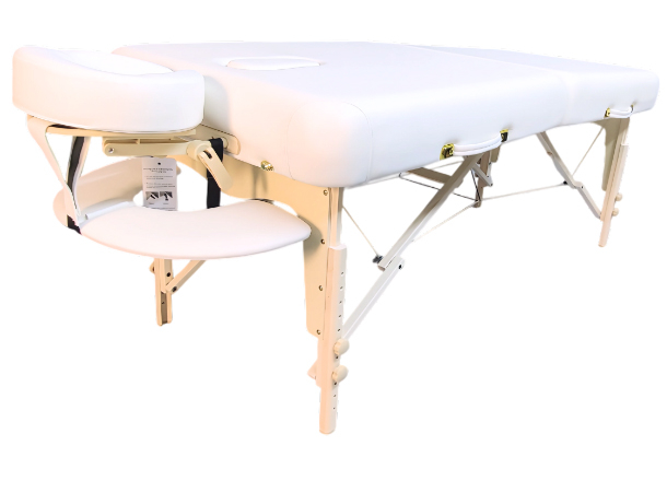 Foldable massage bed with headrest opening